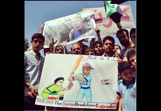 The famous poster artists from Kafranbel depict what they hope for from Obama concerning Bashar al-Assad