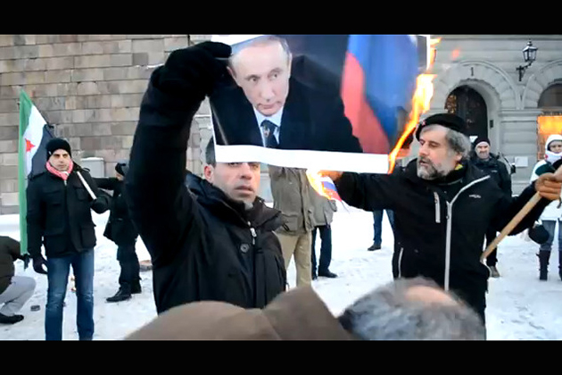 Syrians Burning Vladimir Putin Picture and Russian Flag During Protest in Sweden Syrians Burning Vladimir Putin Picture and Russian Flag During Protest in Sweden